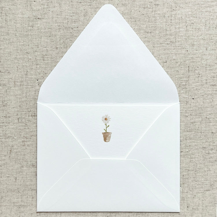 Watercolored potted daisy printed on set of 8 A2 (4.25"x5.5") 120# white eggshell notecard. White envelope. Made in USA.